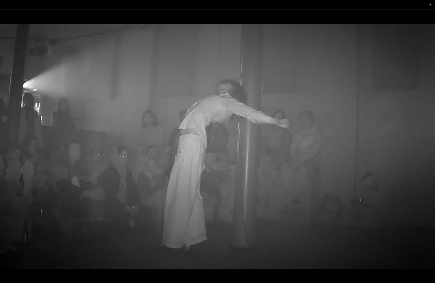 A performer dressed in white