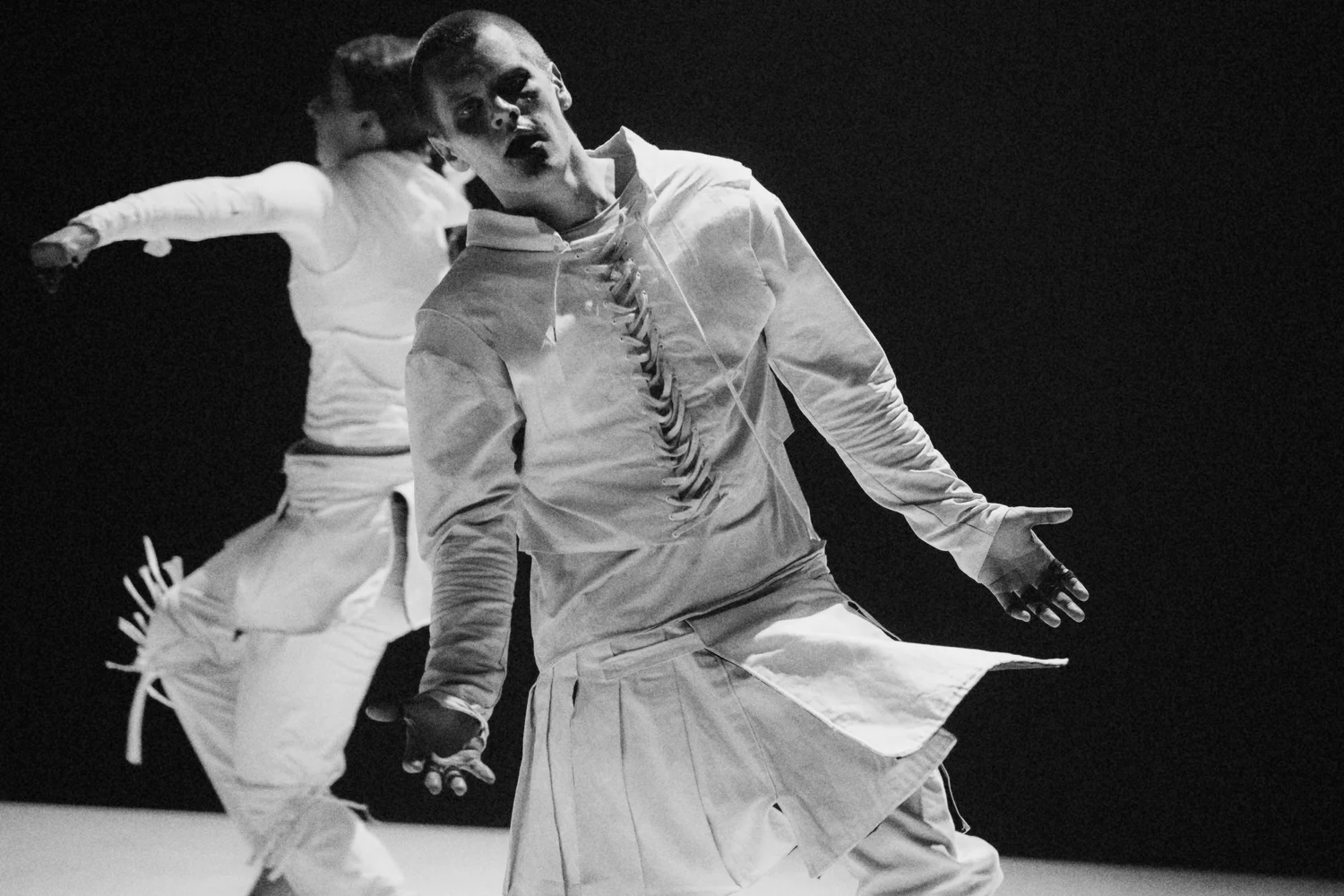 Two performers practising a physical technique