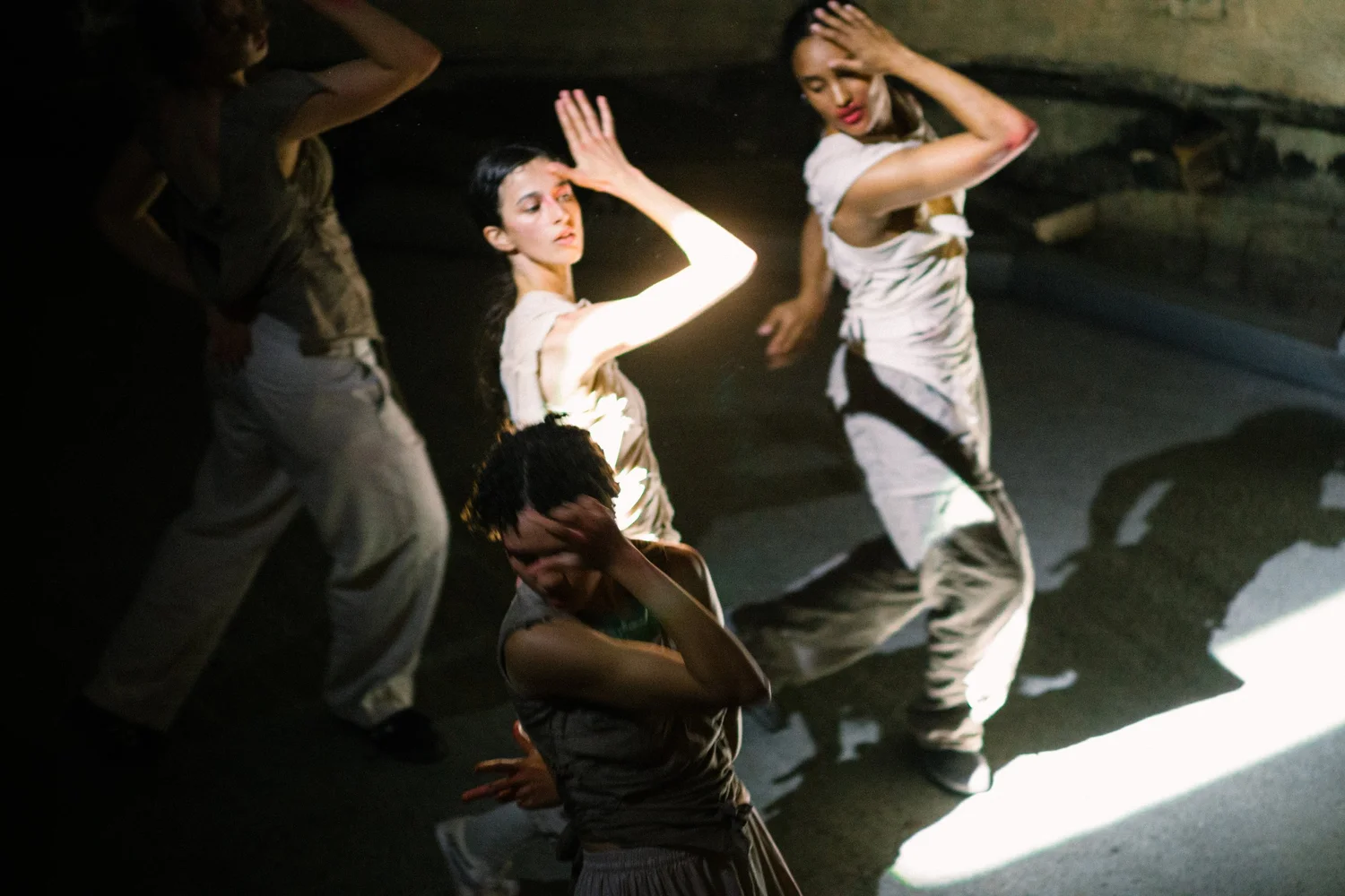 Dancers in a dimly lit room